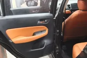 the interior of a car with the door pad work.