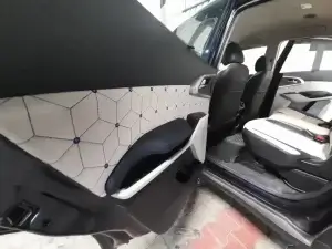 the interior of a car with the door pad work.