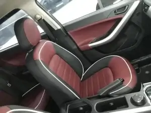 the interior of a car with the door pad work.