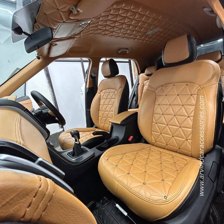 luxurious tan leather seats with diamond stitching, including a view of the steering wheel
