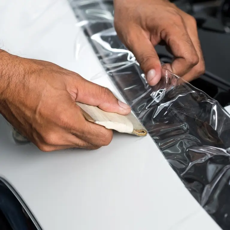 Applying protective film on car surface